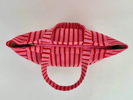 Grote roze shopper met rode strepen.