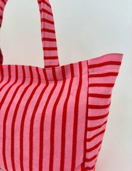 Grote roze shopper met rode strepen.